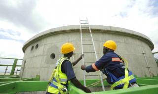 Men working on the a unit of the 2.2MW Gorge Farm AD Plant in Naivasha, Kenya